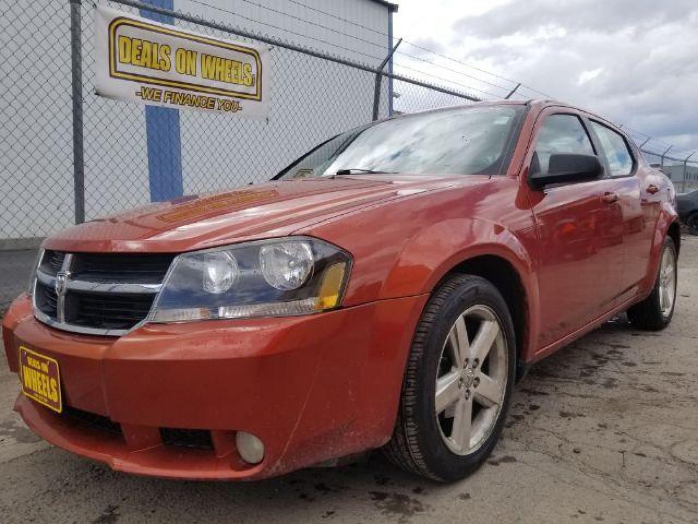 2008 Sunburst Orange Pear Dodge Avenger SXT (1B3LC56R08N) with an 2.7L V6 DOHC 24V FFV engine, 4-Speed Automatic transmission, located at 601 E. Idaho St., Kalispell, MT, 59901, 0.000000, 0.000000 - Photo#0