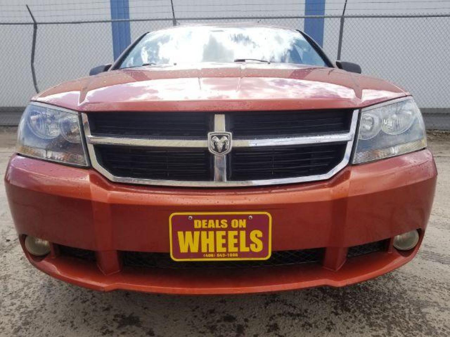 2008 Sunburst Orange Pear Dodge Avenger SXT (1B3LC56R08N) with an 2.7L V6 DOHC 24V FFV engine, 4-Speed Automatic transmission, located at 601 E. Idaho St., Kalispell, MT, 59901, 0.000000, 0.000000 - Photo#1