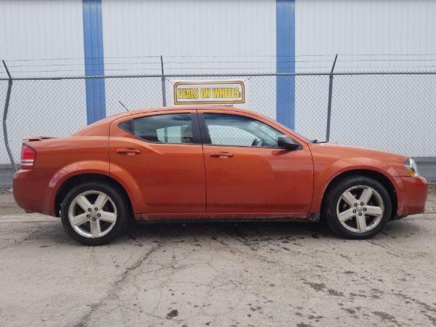 2008 Sunburst Orange Pear Dodge Avenger SXT (1B3LC56R08N) with an 2.7L V6 DOHC 24V FFV engine, 4-Speed Automatic transmission, located at 601 E. Idaho St., Kalispell, MT, 59901, 0.000000, 0.000000 - Photo#3