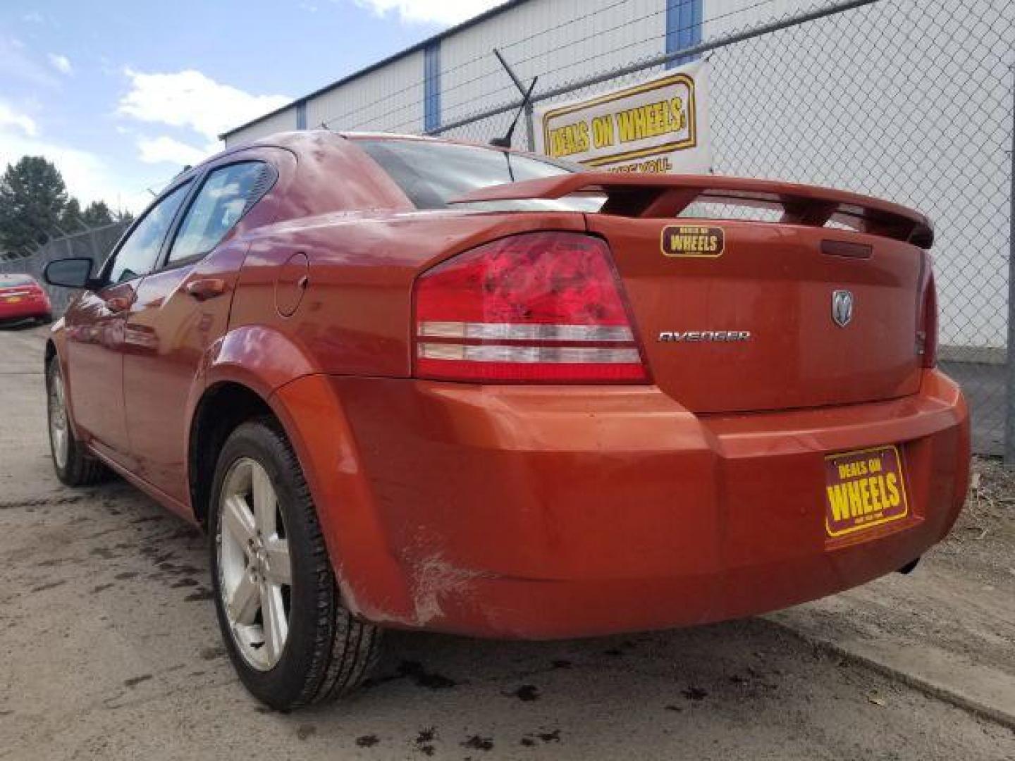 2008 Sunburst Orange Pear Dodge Avenger SXT (1B3LC56R08N) with an 2.7L V6 DOHC 24V FFV engine, 4-Speed Automatic transmission, located at 601 E. Idaho St., Kalispell, MT, 59901, 0.000000, 0.000000 - Photo#5