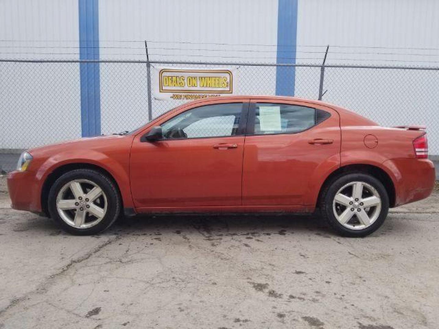 2008 Sunburst Orange Pear Dodge Avenger SXT (1B3LC56R08N) with an 2.7L V6 DOHC 24V FFV engine, 4-Speed Automatic transmission, located at 601 E. Idaho St., Kalispell, MT, 59901, 0.000000, 0.000000 - Photo#6