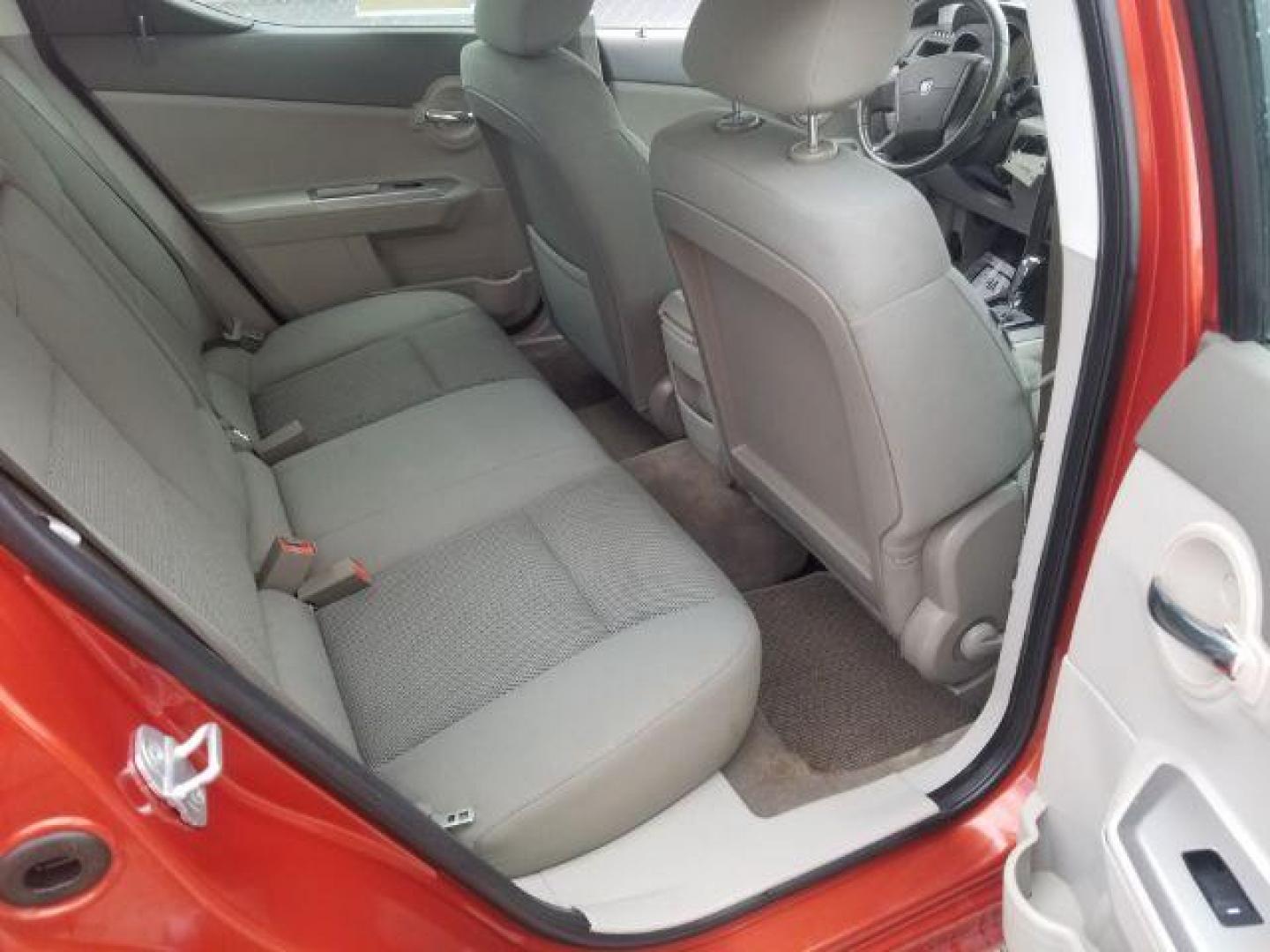 2008 Sunburst Orange Pear Dodge Avenger SXT (1B3LC56R08N) with an 2.7L V6 DOHC 24V FFV engine, 4-Speed Automatic transmission, located at 601 E. Idaho St., Kalispell, MT, 59901, 0.000000, 0.000000 - Photo#9