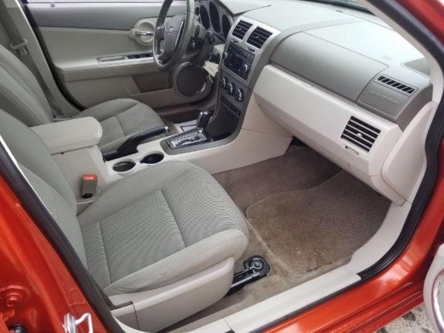 2008 Sunburst Orange Pear Dodge Avenger SXT (1B3LC56R08N) with an 2.7L V6 DOHC 24V FFV engine, 4-Speed Automatic transmission, located at 601 E. Idaho St., Kalispell, MT, 59901, 0.000000, 0.000000 - Photo#10
