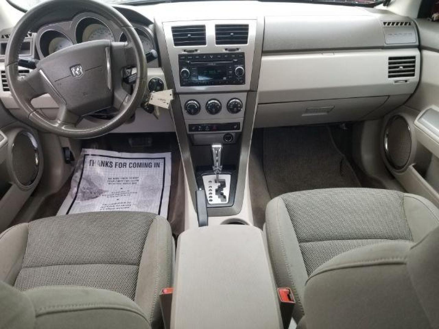 2008 Sunburst Orange Pear Dodge Avenger SXT (1B3LC56R08N) with an 2.7L V6 DOHC 24V FFV engine, 4-Speed Automatic transmission, located at 601 E. Idaho St., Kalispell, MT, 59901, 0.000000, 0.000000 - Photo#11
