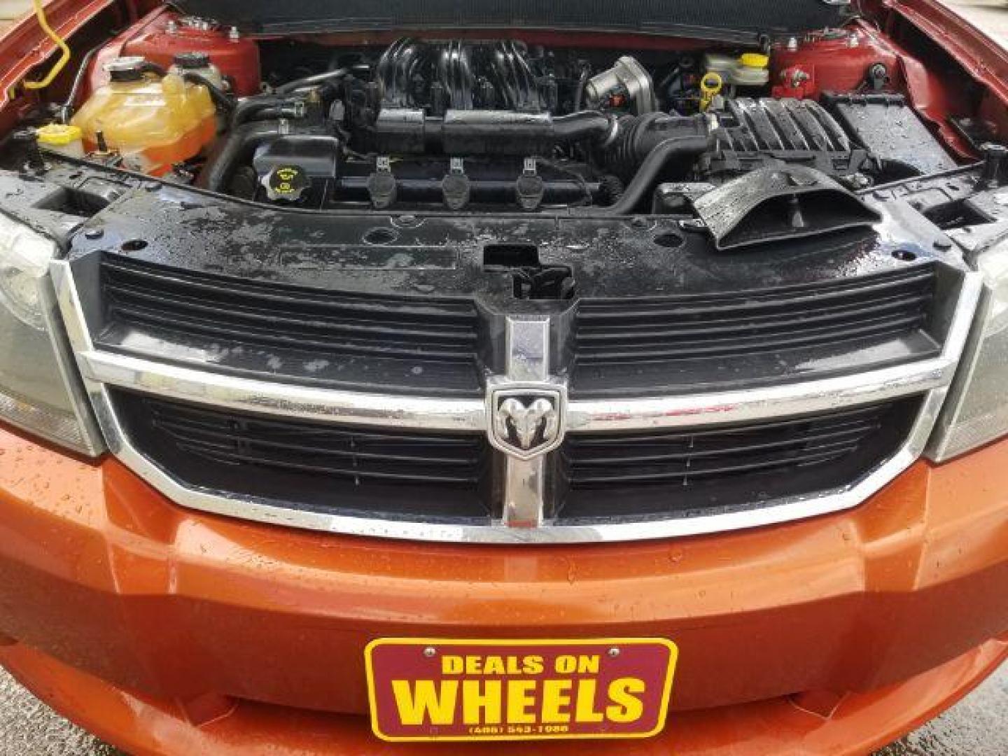 2008 Sunburst Orange Pear Dodge Avenger SXT (1B3LC56R08N) with an 2.7L V6 DOHC 24V FFV engine, 4-Speed Automatic transmission, located at 601 E. Idaho St., Kalispell, MT, 59901, 0.000000, 0.000000 - Photo#13