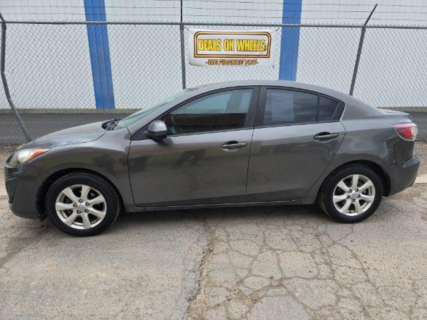 2011 Mazda MAZDA3 i Touring 4-Door (JM1BL1VF2B1) with an 2.0L L4 DOHC 16V engine, 5-Speed Manual transmission, located at 4047 Montana Ave., Billings, MT, 59101, 45.770847, -108.529800 - Photo#1