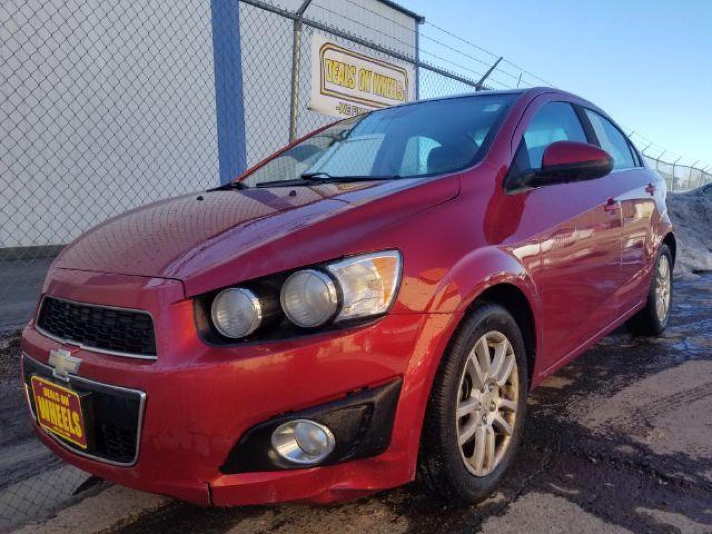 2012 Victory Red Chevrolet Sonic 2LT Sedan (1G1JC5SH9C4) with an 1.8L L4 DOHC 24V engine, 6-Speed Automatic transmission, located at 1821 N Montana Ave., Helena, MT, 59601, 0.000000, 0.000000 - Photo#0