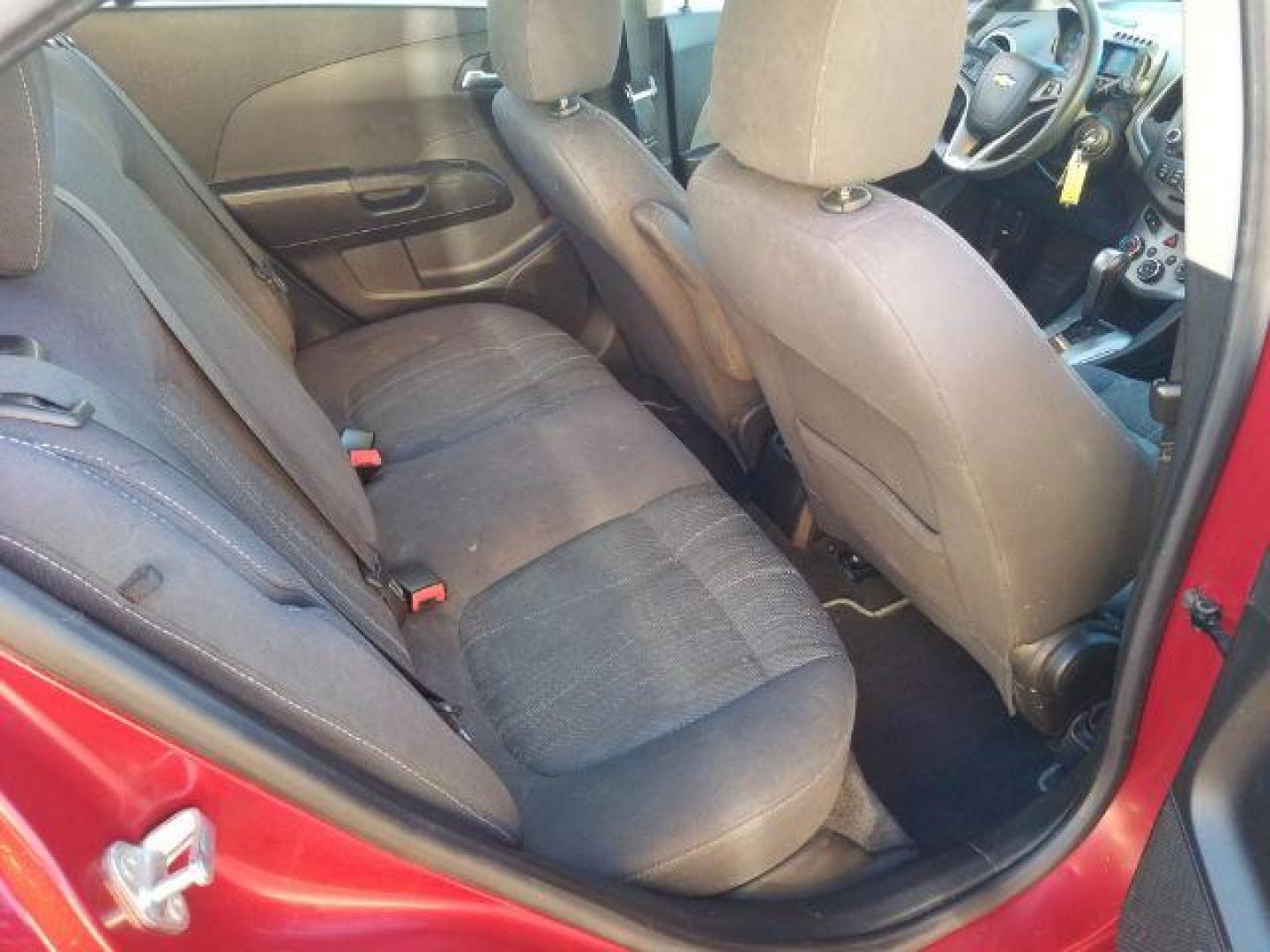 2012 Victory Red Chevrolet Sonic 2LT Sedan (1G1JC5SH9C4) with an 1.8L L4 DOHC 24V engine, 6-Speed Automatic transmission, located at 1821 N Montana Ave., Helena, MT, 59601, 0.000000, 0.000000 - Photo#9