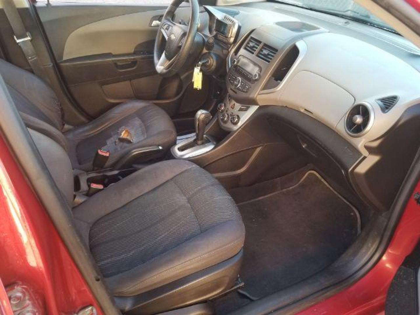 2012 Victory Red Chevrolet Sonic 2LT Sedan (1G1JC5SH9C4) with an 1.8L L4 DOHC 24V engine, 6-Speed Automatic transmission, located at 1821 N Montana Ave., Helena, MT, 59601, 0.000000, 0.000000 - Photo#11