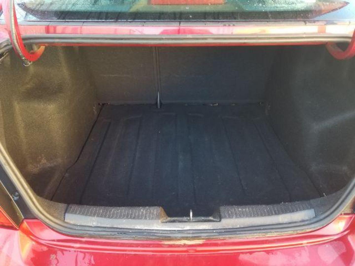 2012 Victory Red Chevrolet Sonic 2LT Sedan (1G1JC5SH9C4) with an 1.8L L4 DOHC 24V engine, 6-Speed Automatic transmission, located at 1821 N Montana Ave., Helena, MT, 59601, 0.000000, 0.000000 - Photo#12
