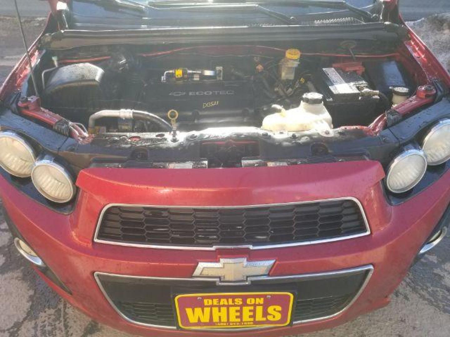 2012 Victory Red Chevrolet Sonic 2LT Sedan (1G1JC5SH9C4) with an 1.8L L4 DOHC 24V engine, 6-Speed Automatic transmission, located at 1821 N Montana Ave., Helena, MT, 59601, 0.000000, 0.000000 - Photo#13