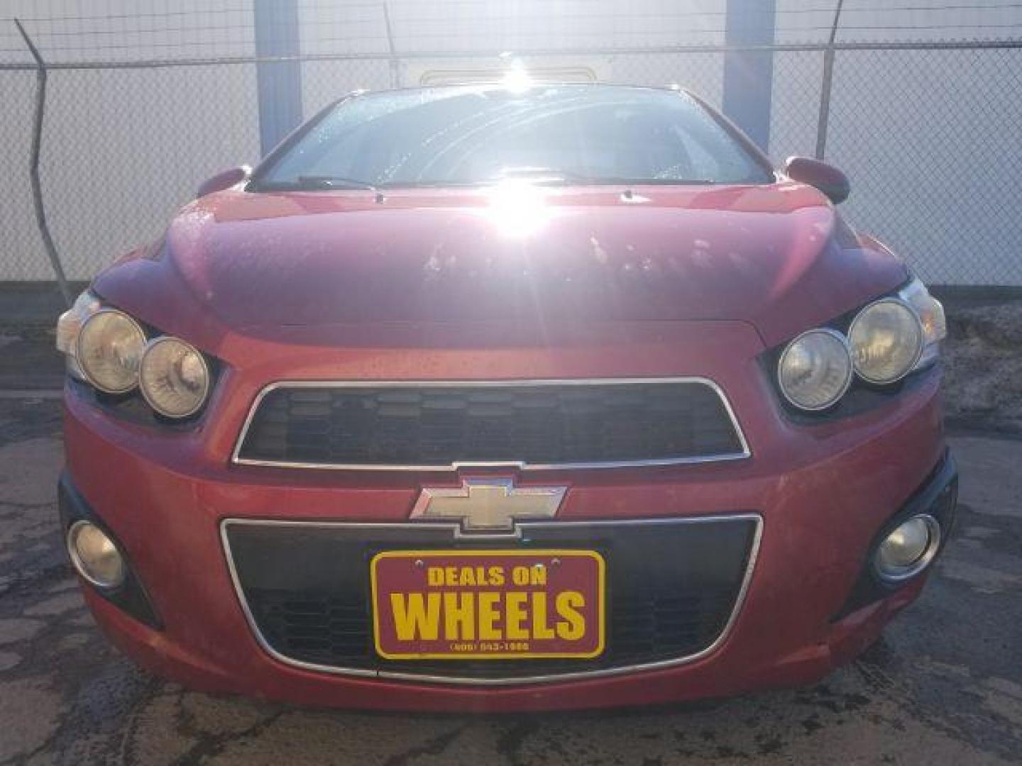 2012 Victory Red Chevrolet Sonic 2LT Sedan (1G1JC5SH9C4) with an 1.8L L4 DOHC 24V engine, 6-Speed Automatic transmission, located at 1821 N Montana Ave., Helena, MT, 59601, 0.000000, 0.000000 - Photo#1