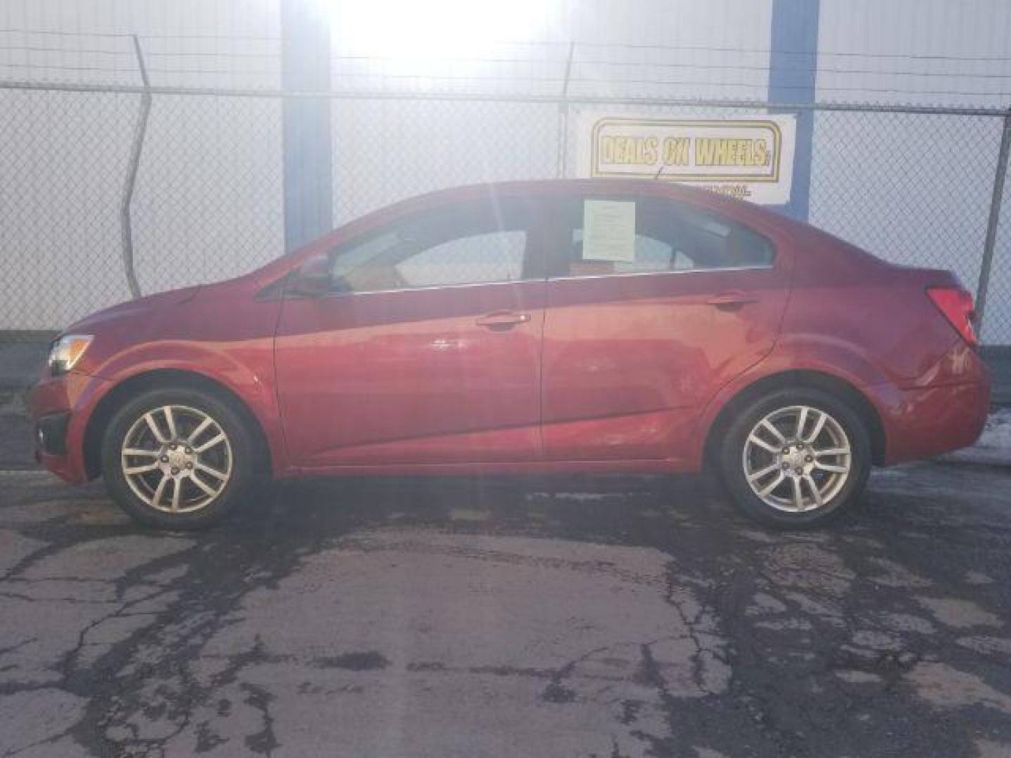 2012 Victory Red Chevrolet Sonic 2LT Sedan (1G1JC5SH9C4) with an 1.8L L4 DOHC 24V engine, 6-Speed Automatic transmission, located at 1821 N Montana Ave., Helena, MT, 59601, 0.000000, 0.000000 - Photo#6
