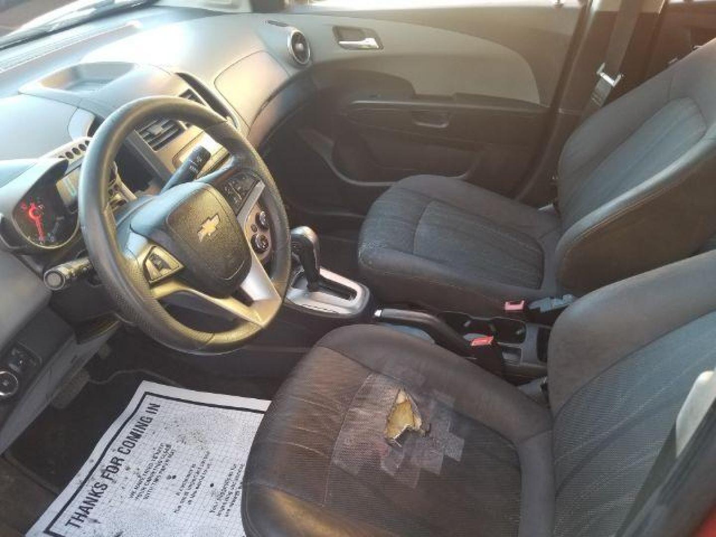 2012 Victory Red Chevrolet Sonic 2LT Sedan (1G1JC5SH9C4) with an 1.8L L4 DOHC 24V engine, 6-Speed Automatic transmission, located at 1821 N Montana Ave., Helena, MT, 59601, 0.000000, 0.000000 - Photo#7
