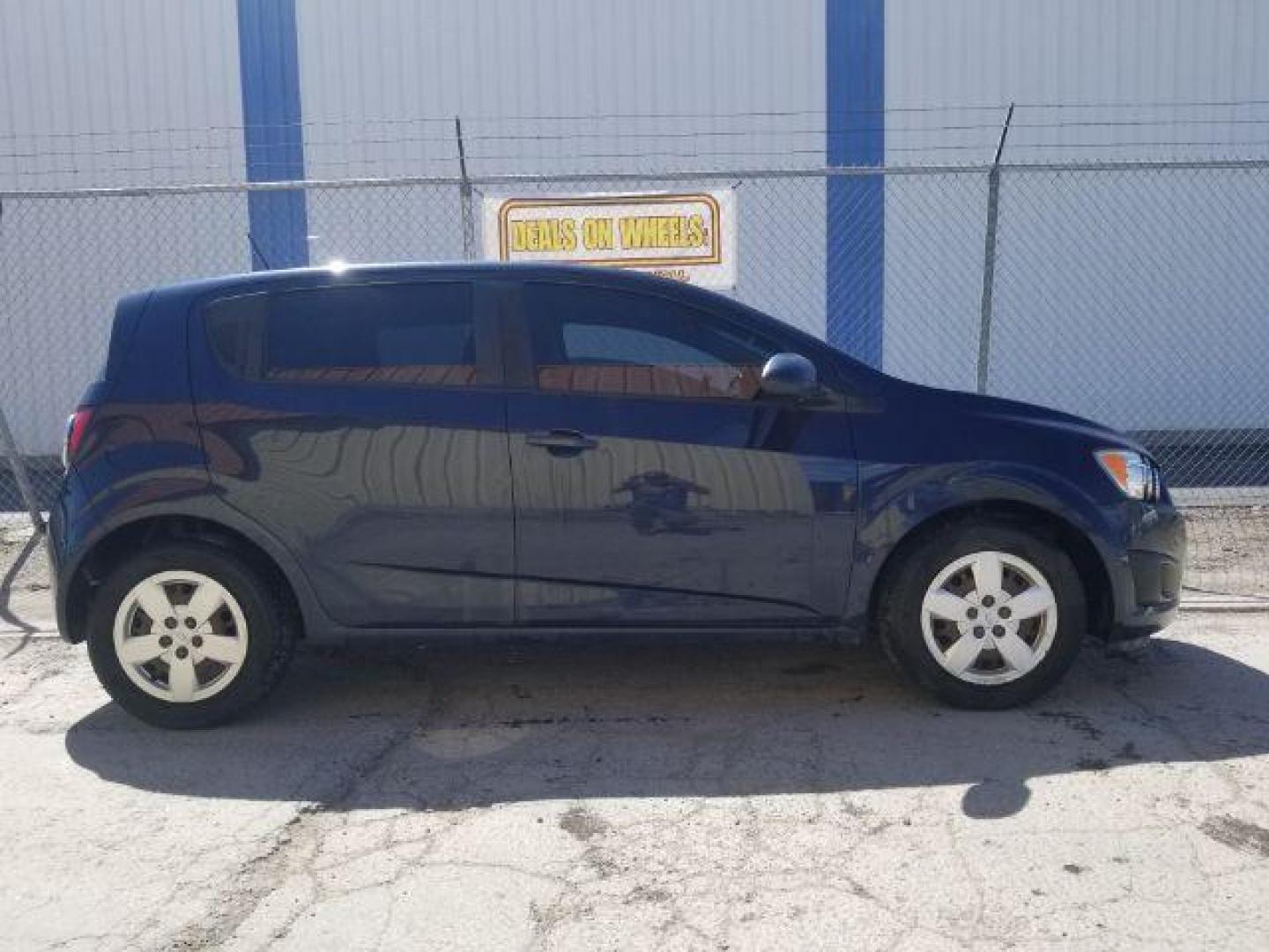 2015 Chevrolet Sonic LS Manual (1G1JB6SH1F4) with an ECOTEC 1.8L I-4 DOHC engine, located at 4801 10th Ave S,, Great Falls, MT, 59405, 0.000000, 0.000000 - Photo#3