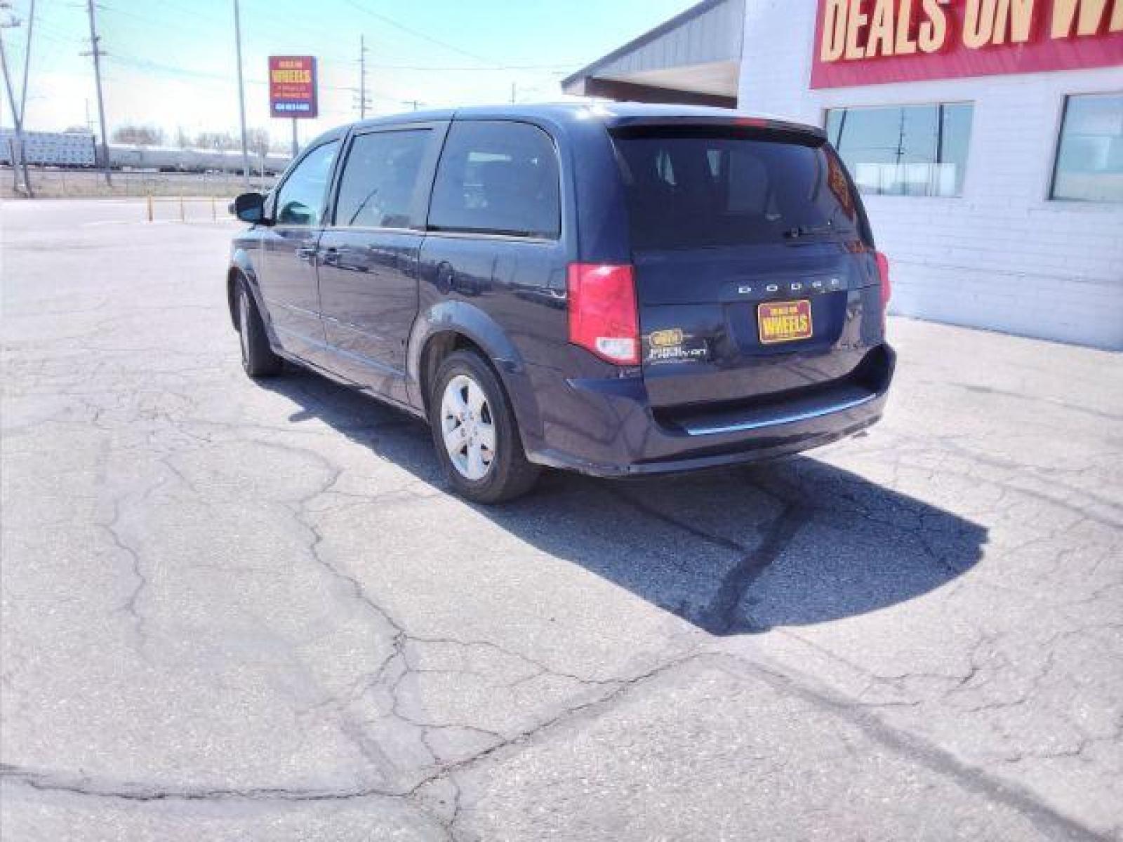 2013 Blue Streak Pearl Dodge Grand Caravan SE (2C4RDGBG5DR) with an 3.6L V6 DOHC 24V engine, 6-Speed Automatic transmission, located at 4047 Montana Ave, Billings, MT, 59101, (406) 543-1986, 45.770824, -108.529411 - Photo #2